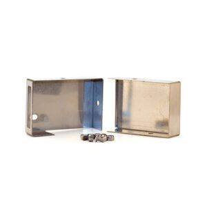 Metal brackets and screws on white background.