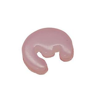 Pink crescent-shaped dental wax bite block.