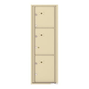 Three beige metal mailboxes