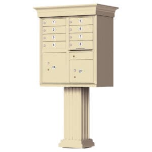 Clustered tan mailbox unit on pedestal.