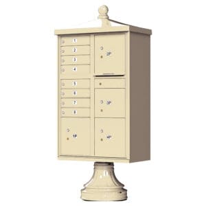 Cluster mailbox with multiple compartments on pedestal.