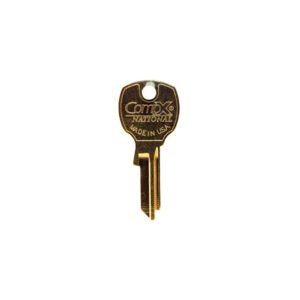 Gold key with "Compx" and "Made in USA".